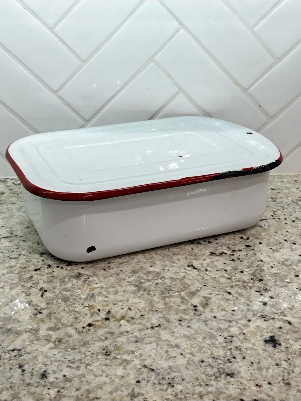 Vintage white enamel pan with red trim